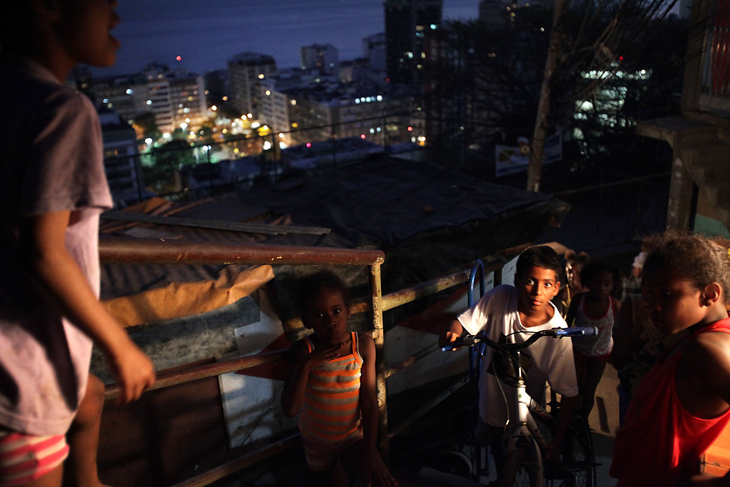 Kids have the freedom to play outdoors at night now that their parents no longer worry that they'll get caught in a crossfire.